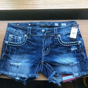 Distressed, embellished jean shorts. Brand Miss Me